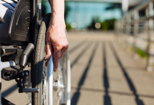 Closeup of person using wheelchair