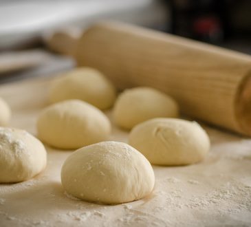 Balls of dough and a rolling pin