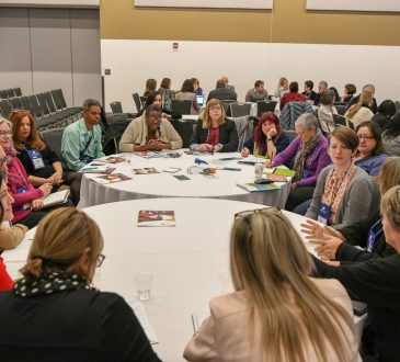 people sitting at round tables at CERIC's Cannexus19 conference
