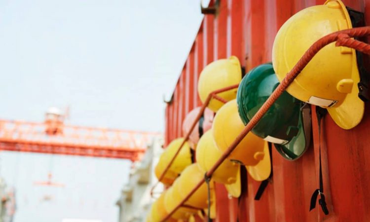 hard hats hanging on red trailer