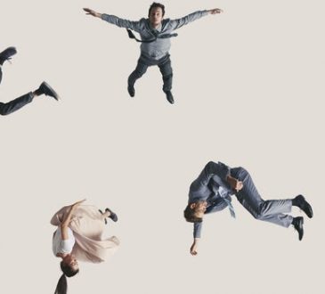 people falling on beige background