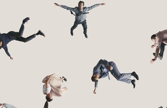 people falling on beige background