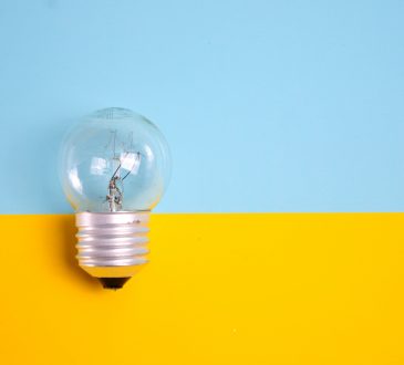 light bulb on blue and yellow background