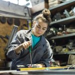 young woman working in a workshop