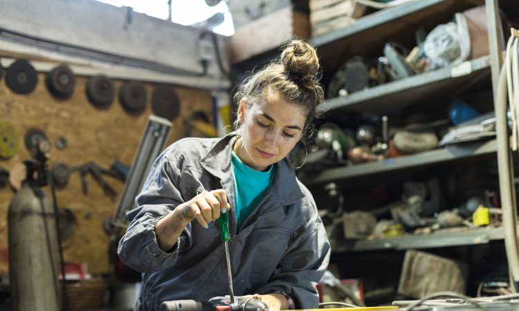 young woman working in a workshop