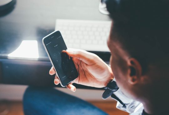 man looking at phone