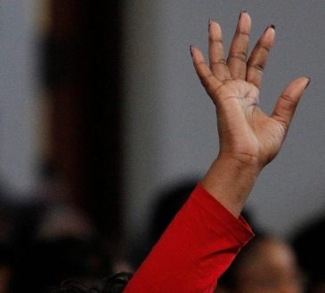 black woman raising hand