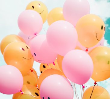 balloons with smiley and sad faces