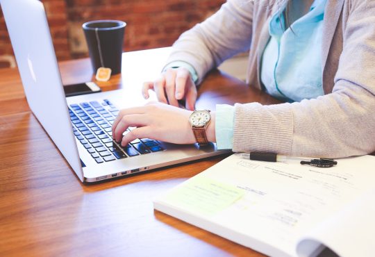 person typing on computer