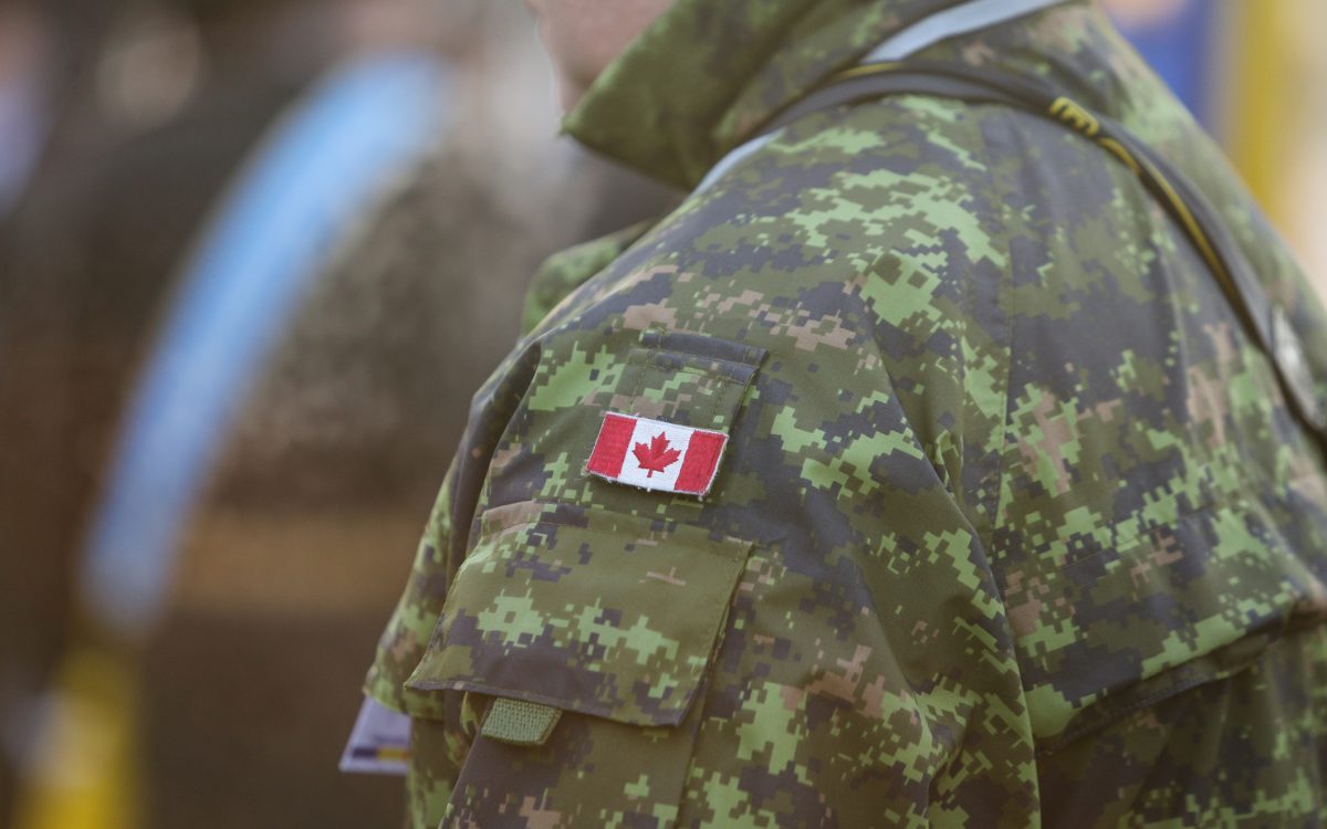 canadian soldier shoulder in camo with canadian flag
