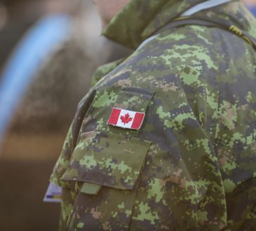 canadian soldier shoulder in camo with canadian flag