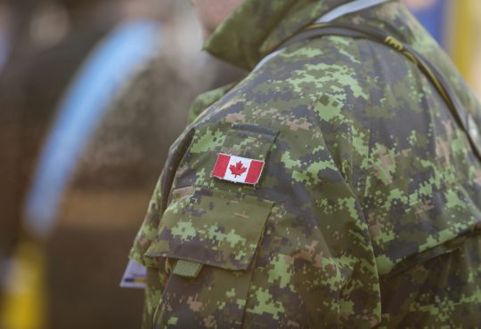 canadian soldier shoulder in camo with canadian flag