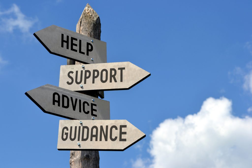 signs reading help, support, advice and guidance