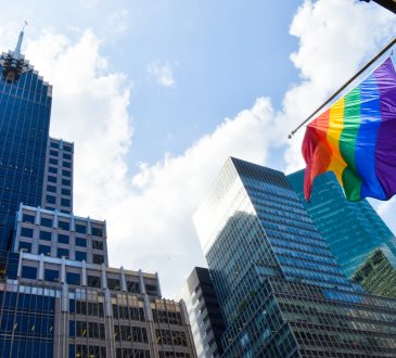 Rainbow flag flying from building