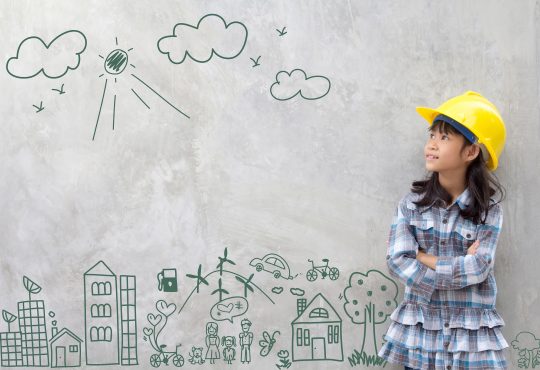 Little girl wearing construction hat