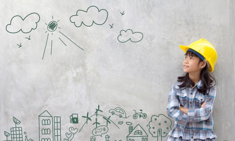 Little girl wearing construction hat