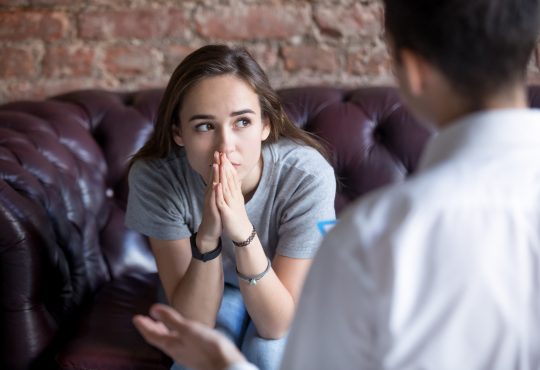 Young woman visiting therapist