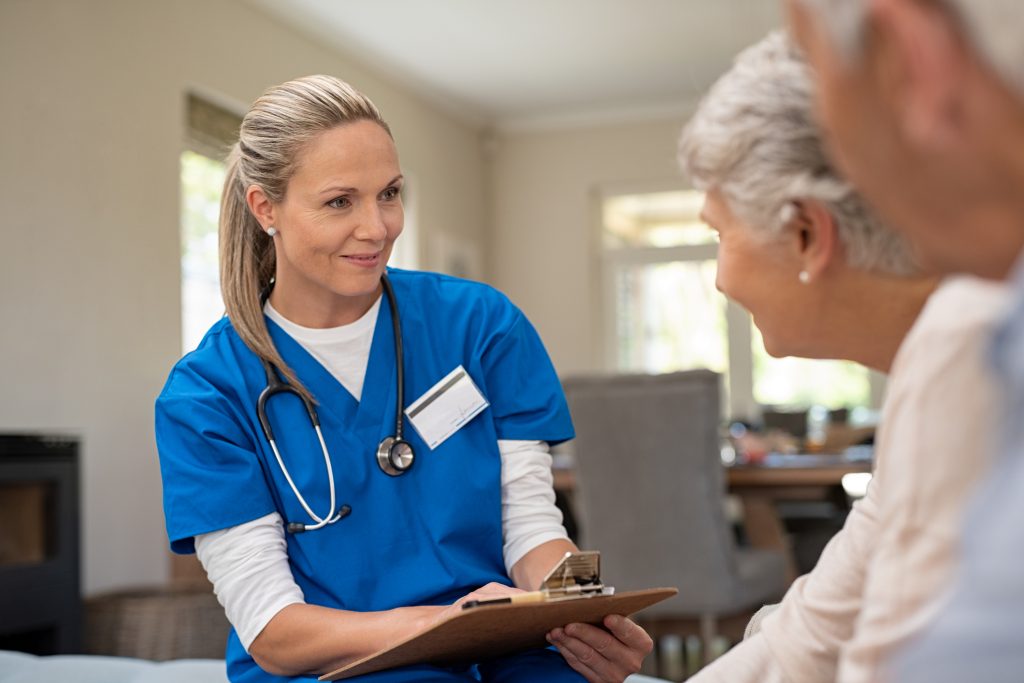 nurse talking to senior patients