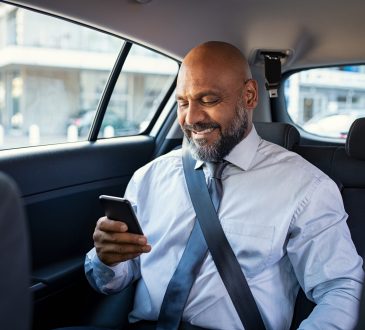 businessman in car on cellphone