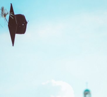 graduation cap flying through the air