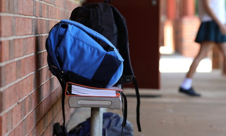 backpack on bench at high school