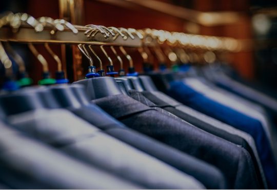 suit jackets hanging on rack