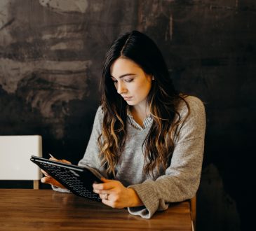 woman reading tablet