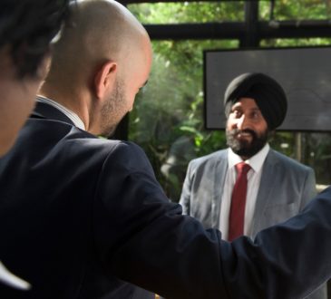 sikh man talking to colleagues