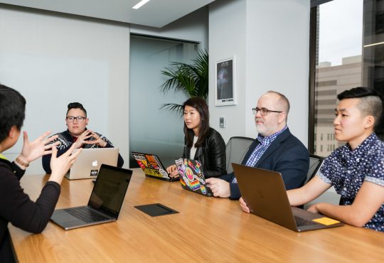 People sitting in board room in office