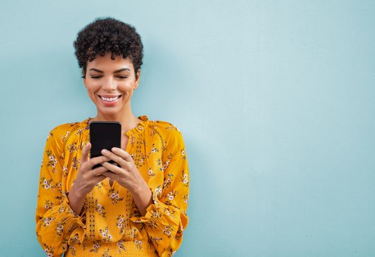 happy woman using phone