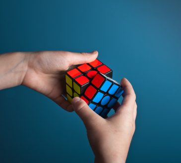 person working on rubik's cube