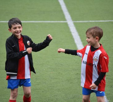 two boys in soccer field