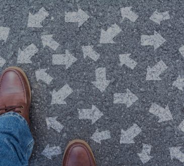 overhead view of shoes with arrows pointing in all directions