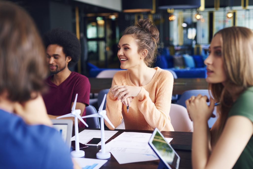 students sitting around table together