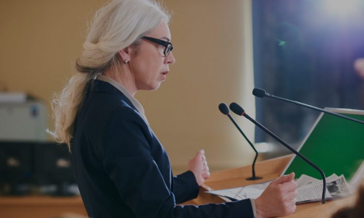 woman speaking at podium