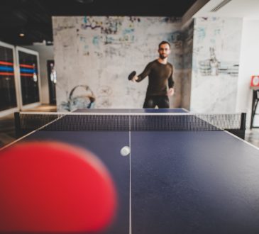 people playing ping pong at work