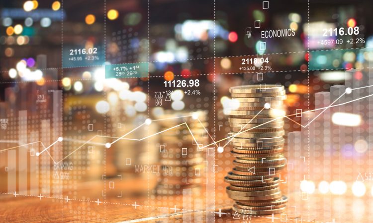 usinesss charts of graph and rows of coins for finance at night city background.