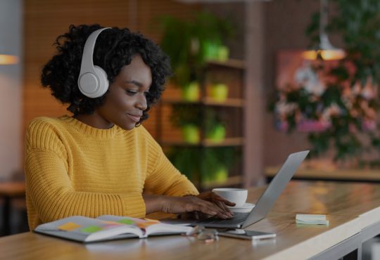 woman watching webinar on laptop