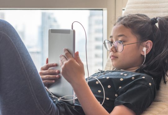 Girl using tablet computer