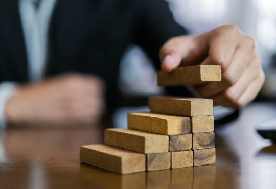 stacking blocks to build staircase