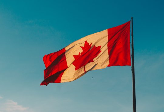 canadian flag waving in wind