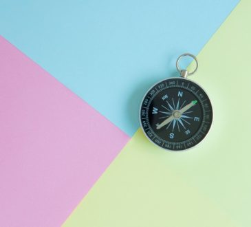 compass on multi-coloured background