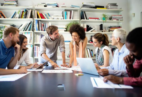 Successful group of business people at work in modern office