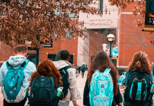 Group of students walking on university campus