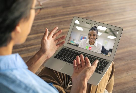 two men having video call