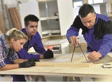 students working in woodshop