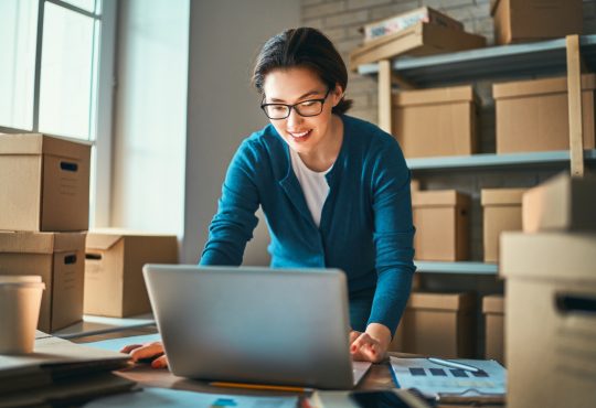 Woman is working at warehouse for online seller.