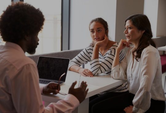 mother and daughter in meeting with teacher