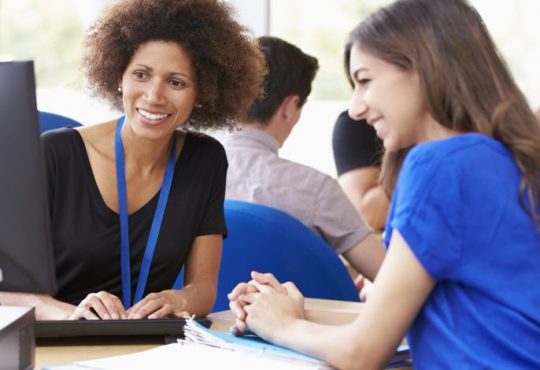 woman working with student in career services