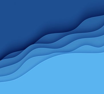 Blue abstract background in paper cut style mimicking waves